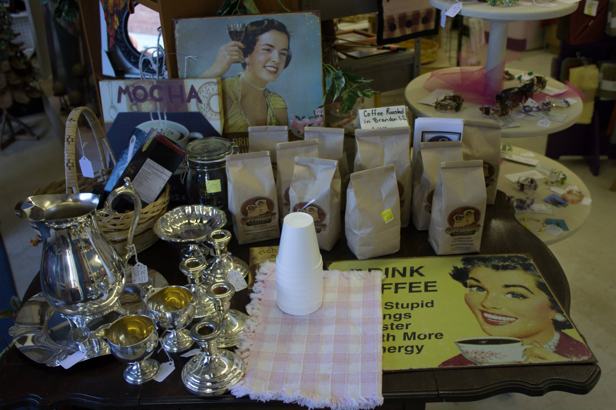 Coffee display with vintage silverware and decor