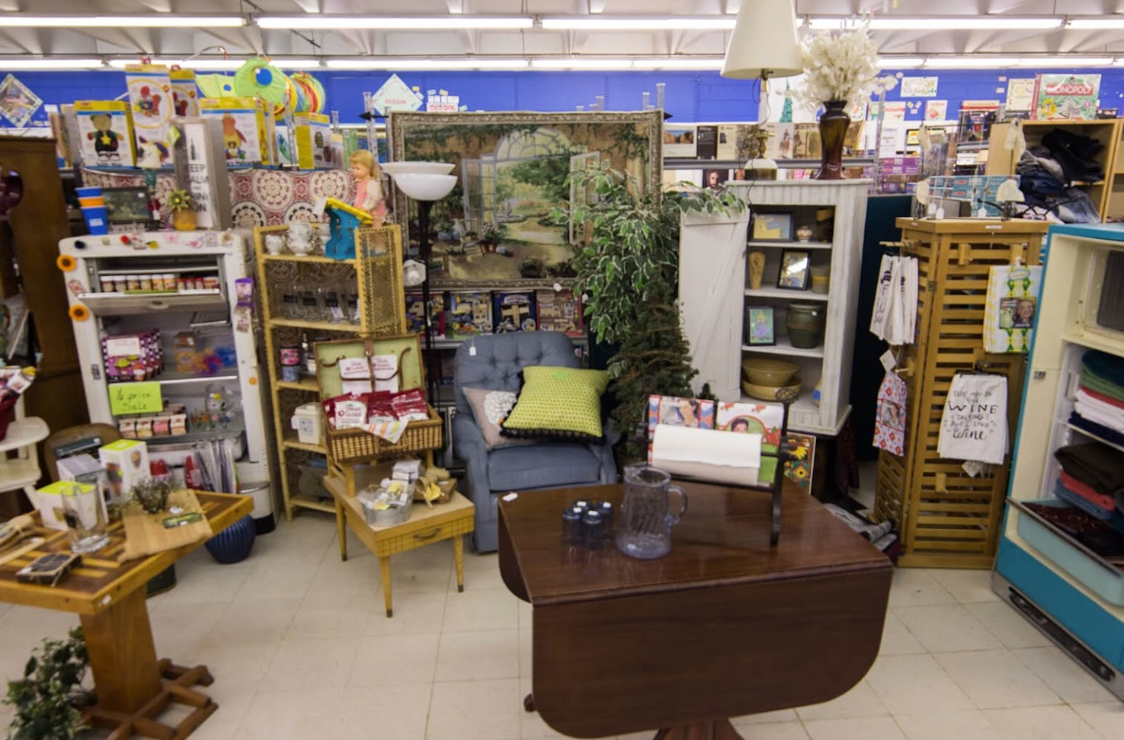 Vintage furniture, art, plants, and home decor inside The Treasure Chest